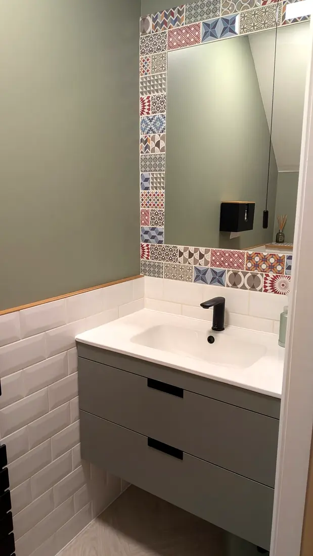 A cloakroom with a fitted vanity unit by Pete Hughes Property Services