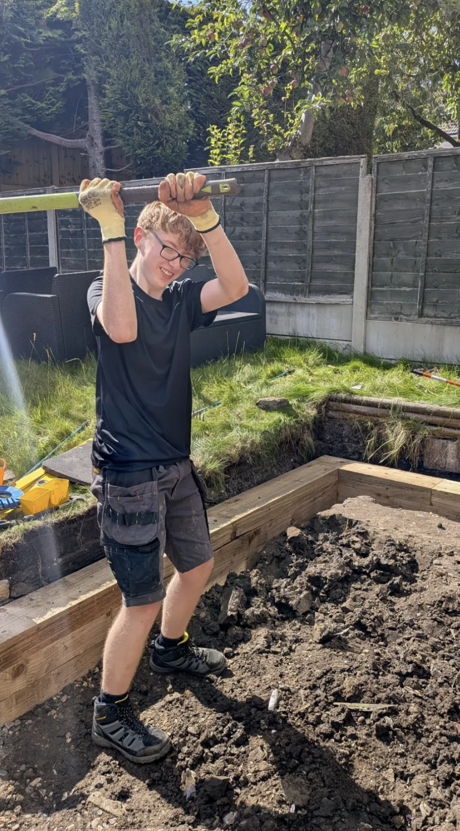 Joshua Heap working on a garden landscaping project